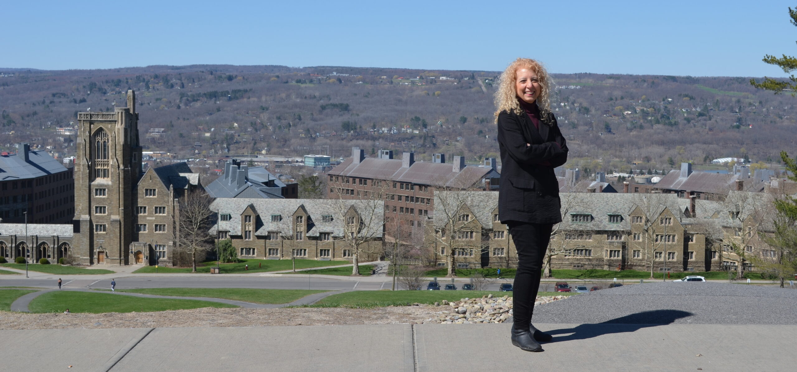 Dr. Mary Balliett in front of Cornell University